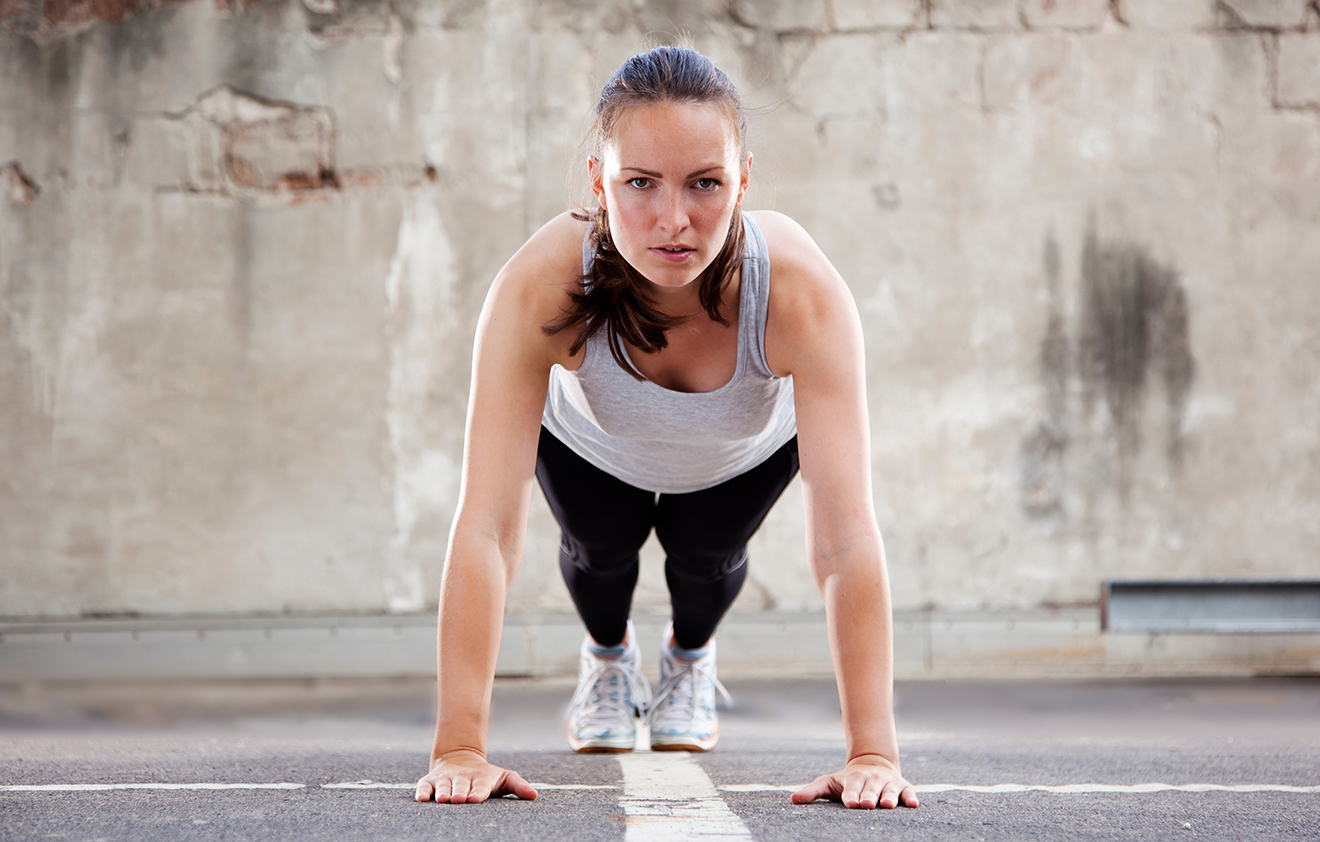 Women doing Burpees best for her entire body workout 